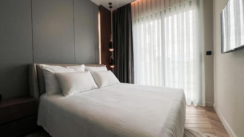 Postel nebo postele na pokoji v ubytování Apart hotel Emiia
