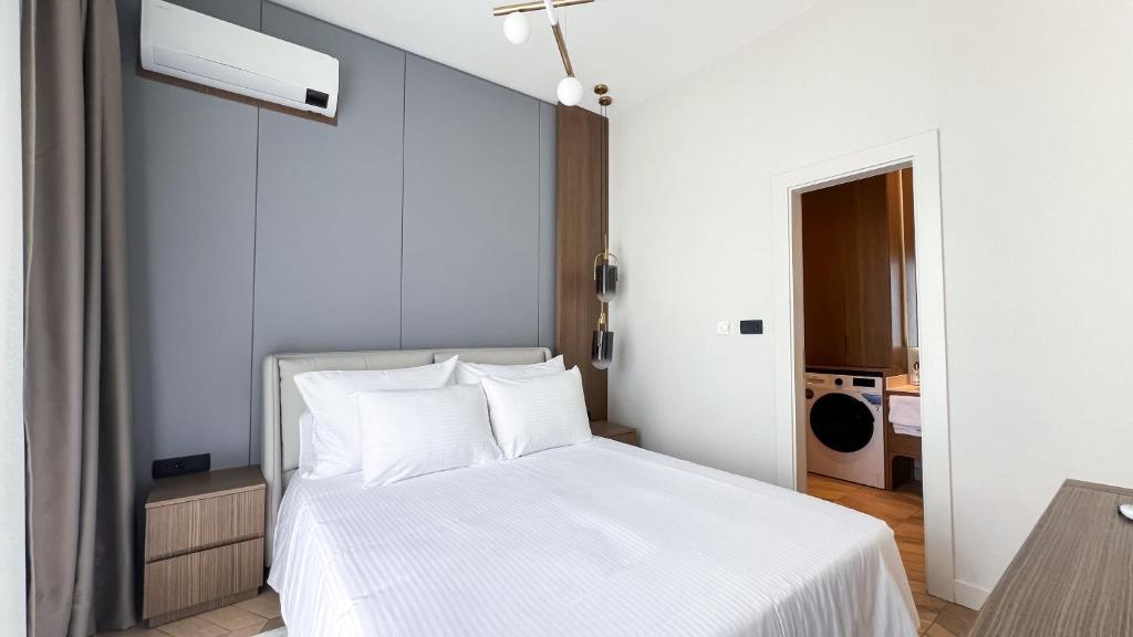 Postel nebo postele na pokoji v ubytování Apart hotel Emiia