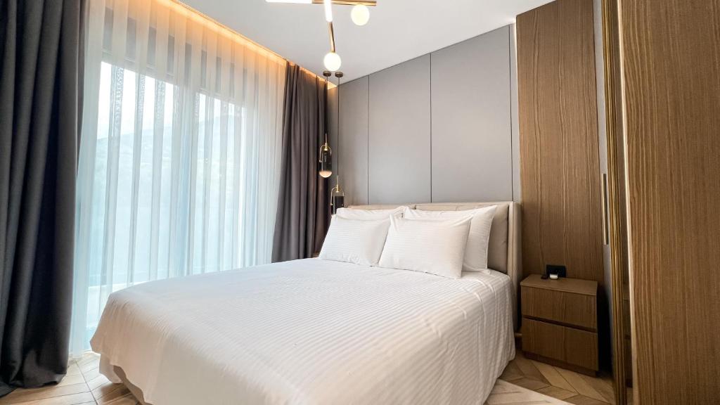 Postel nebo postele na pokoji v ubytování Apart hotel Emiia