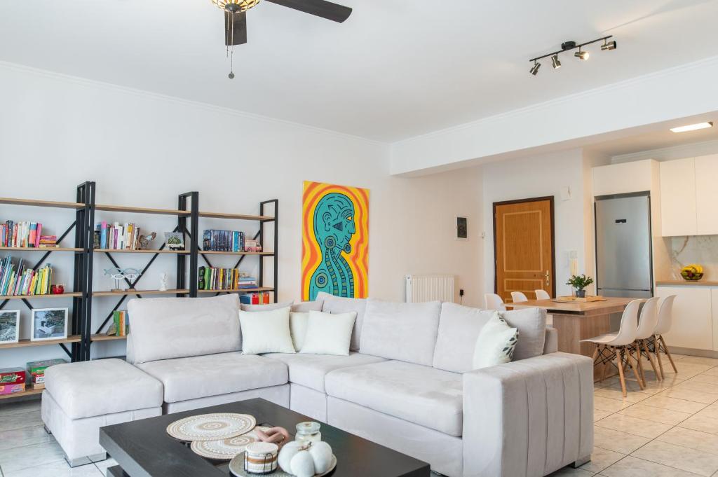 a living room with a couch and a table at Island Memories Apartment in Ampavris
