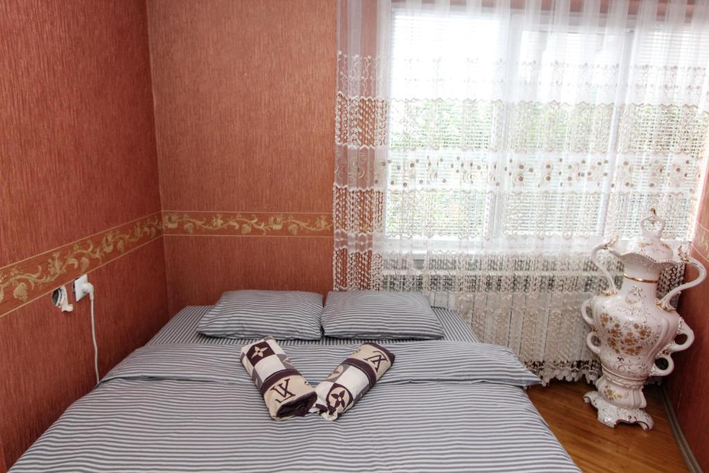 Postel nebo postele na pokoji v ubytování Будинок "Змерега"