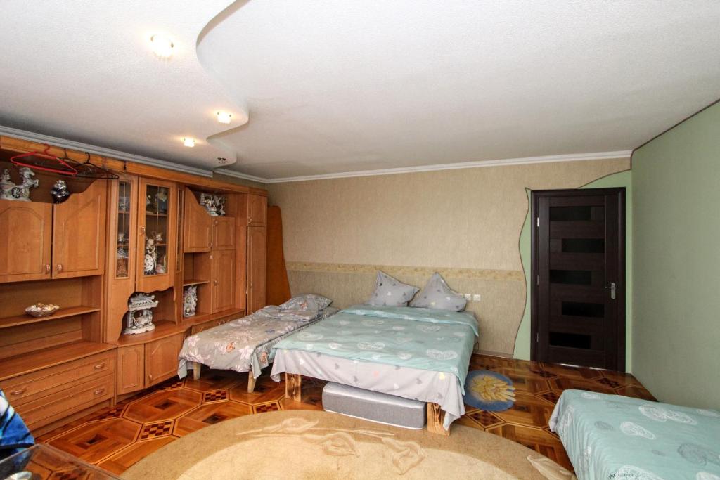 Postel nebo postele na pokoji v ubytování Будинок "Змерега"
