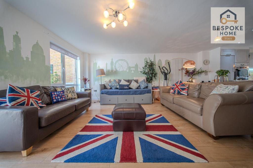 a living room with two couches and a rug at Modern 4 Bed 3 Bath House - 4 Groups with FREE Parking - Central London in London