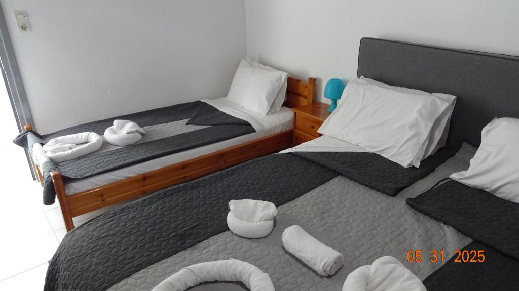 Postel nebo postele na pokoji v ubytování Scirocco Rooms