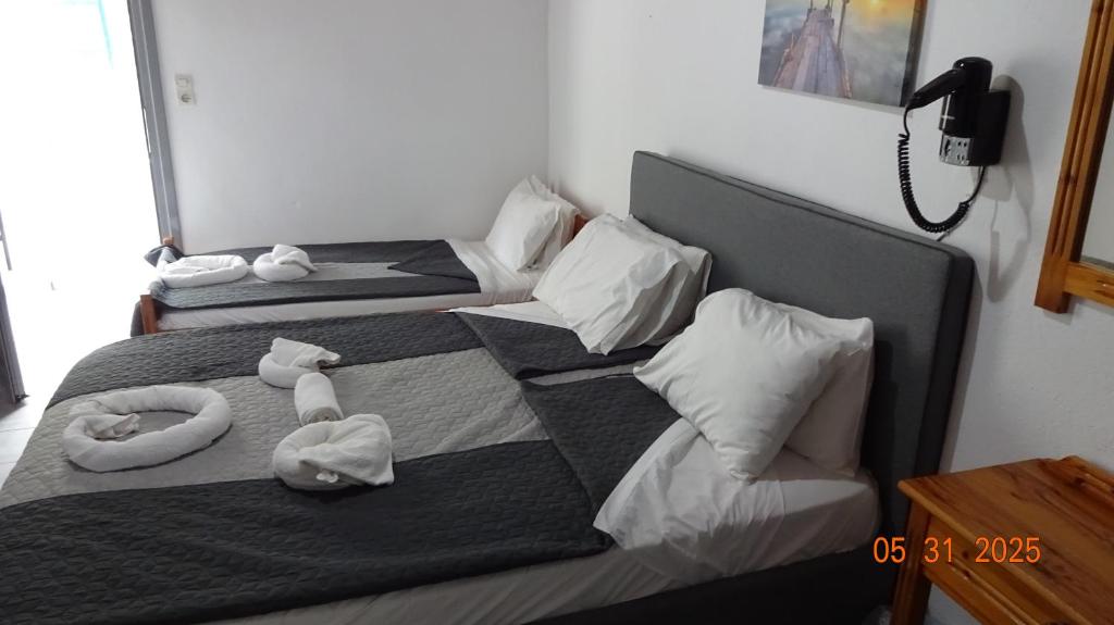 Postel nebo postele na pokoji v ubytování Scirocco Rooms