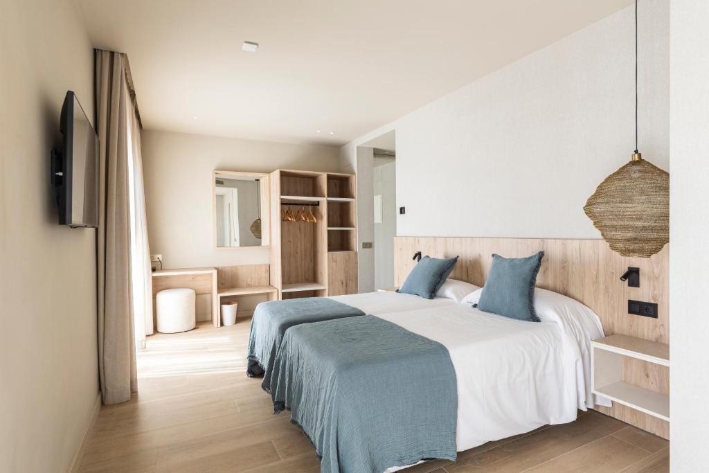 Posteľ alebo postele v izbe v ubytovaní Hotel Casamar