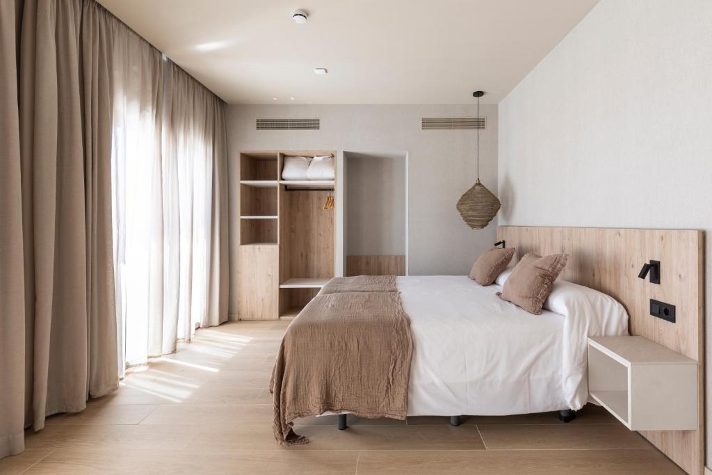 Posteľ alebo postele v izbe v ubytovaní Hotel Casamar