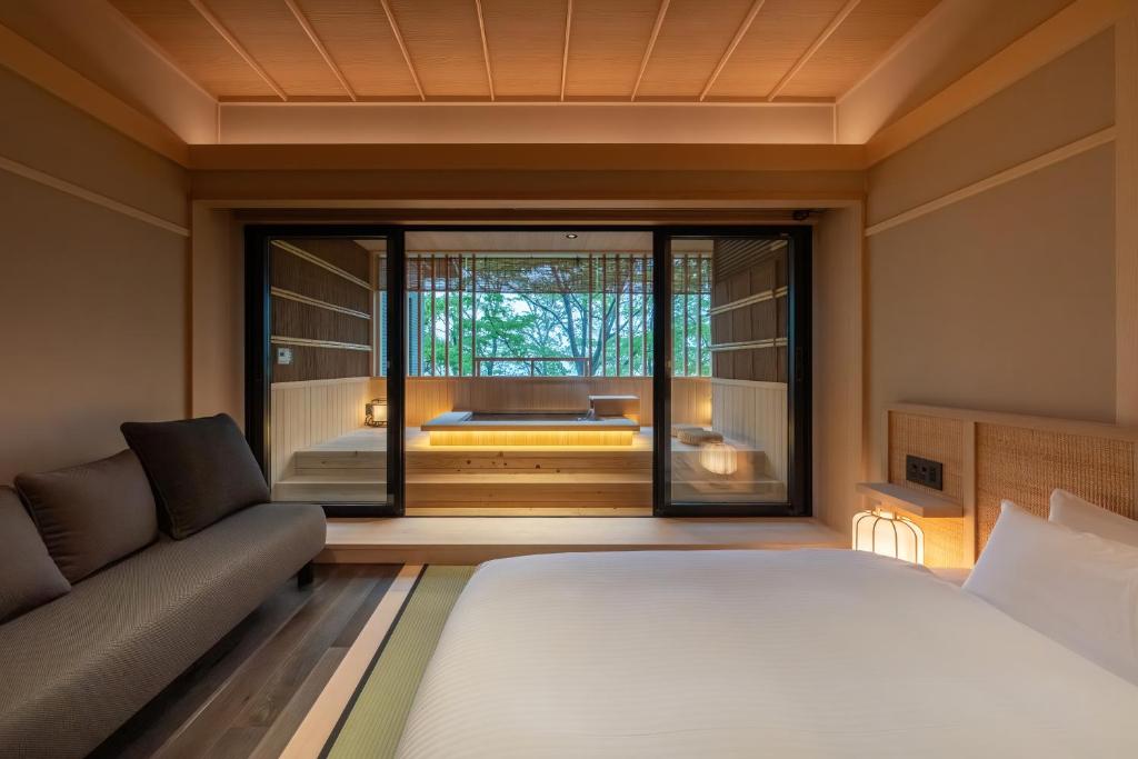 Postel nebo postele na pokoji v ubytování Nazuna Hakone Miyanosita
