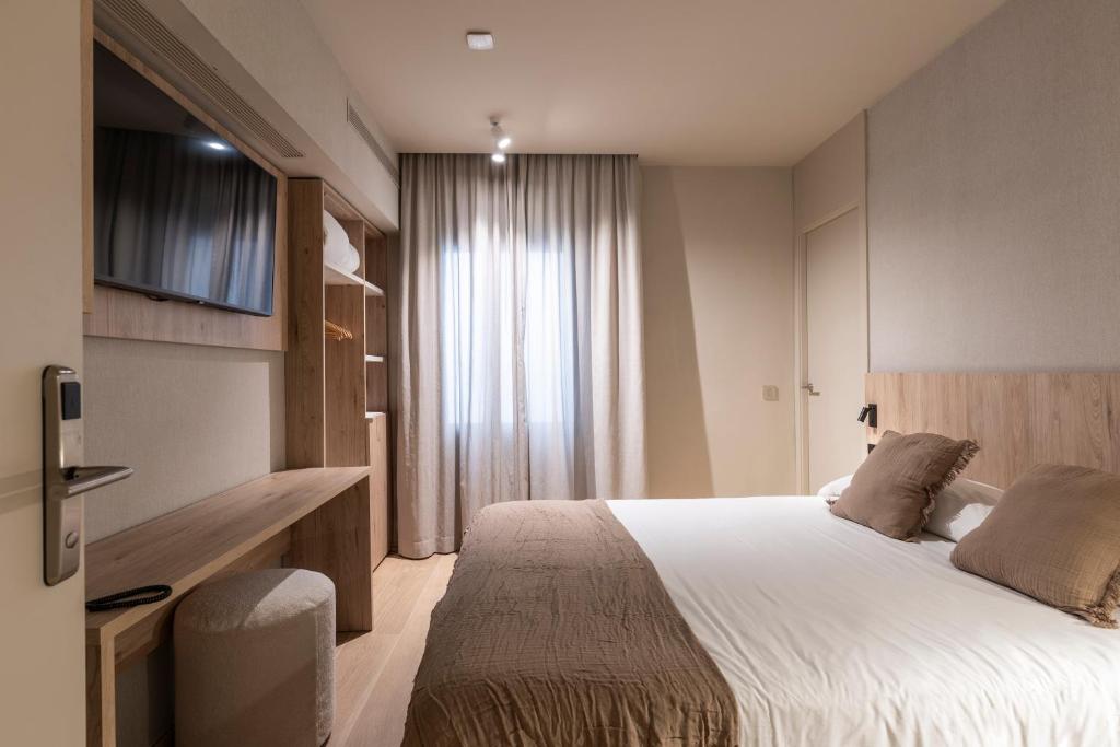 Posteľ alebo postele v izbe v ubytovaní Hotel Casamar