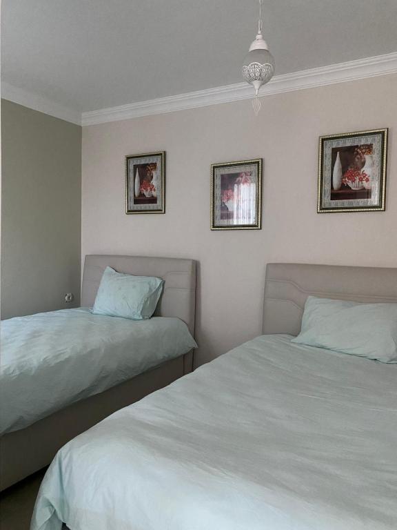 Postel nebo postele na pokoji v ubytování Trabzon Sea Pearl