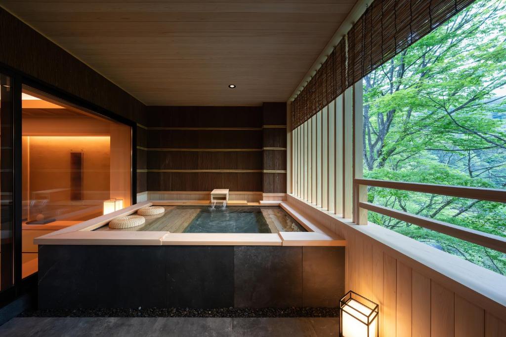 Postel nebo postele na pokoji v ubytování Nazuna Hakone Miyanosita