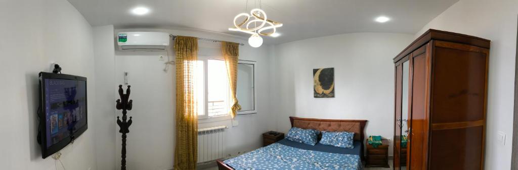 Ένα ή περισσότερα κρεβάτια σε δωμάτιο στο Apartment Rental F3 with sea view