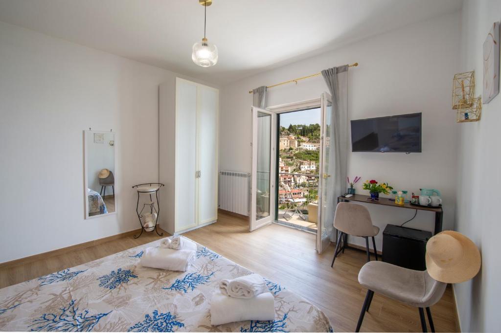 Postel nebo postele na pokoji v ubytování Malù B&B