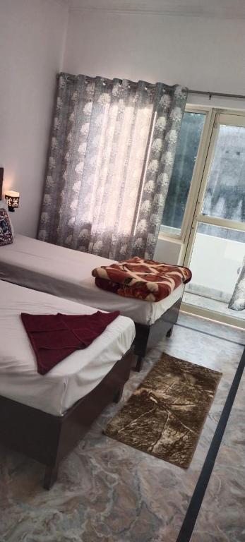 Postel nebo postele na pokoji v ubytování Karma Hostel