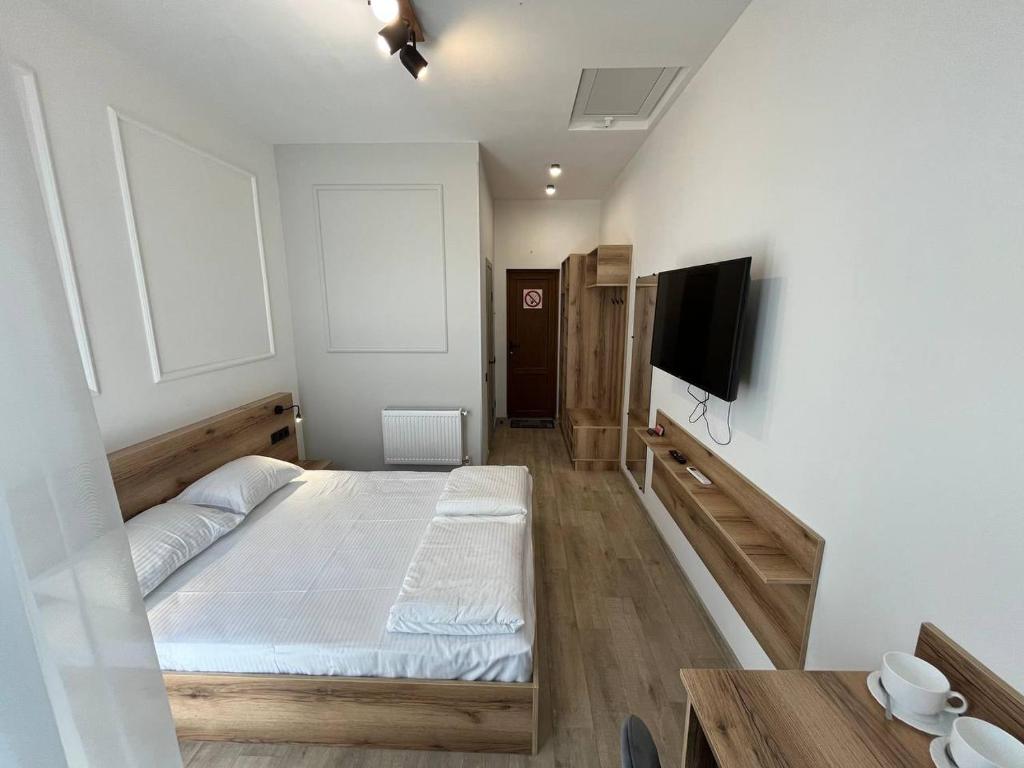 Postel nebo postele na pokoji v ubytování FOX Hostel
