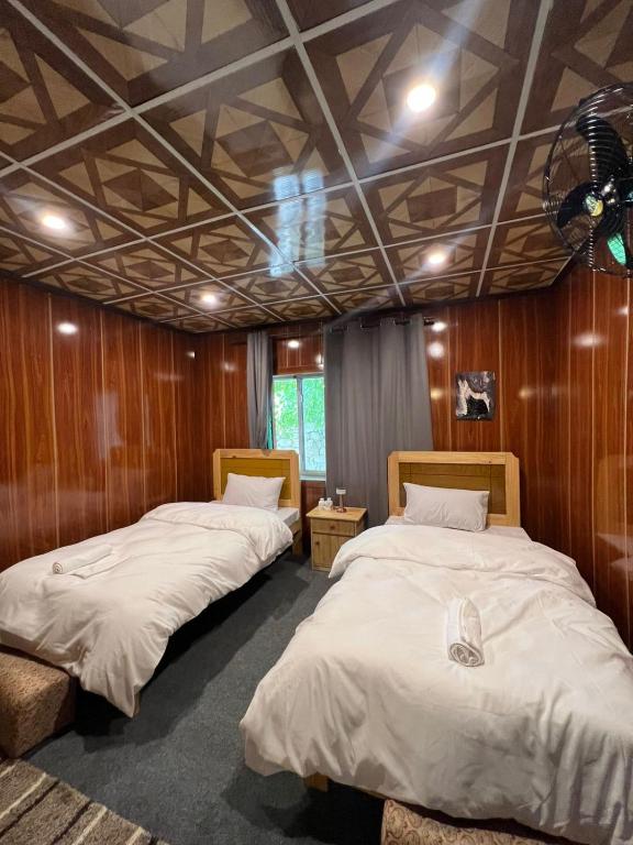Postel nebo postele na pokoji v ubytování Mindok Guest House