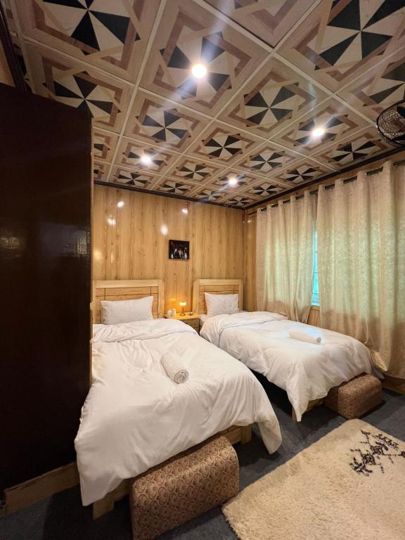Postel nebo postele na pokoji v ubytování Mindok Guest House