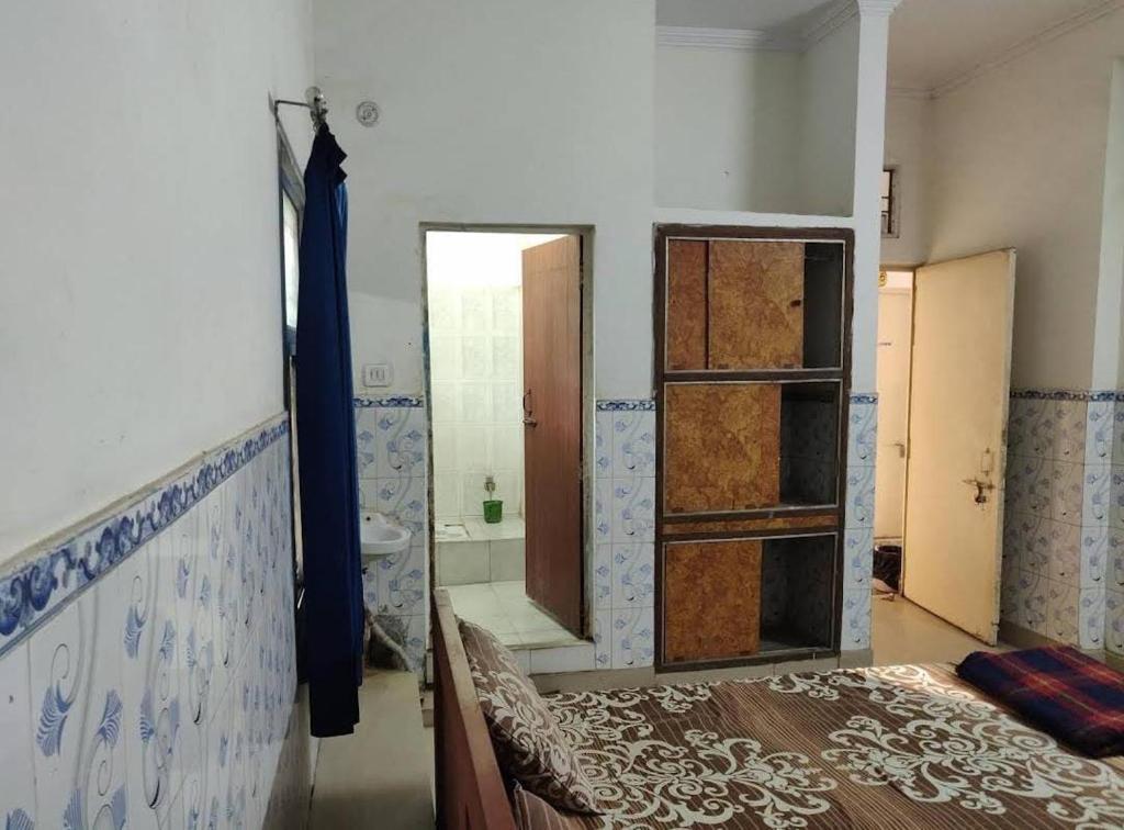 Postel nebo postele na pokoji v ubytování Hotel Satya Narayan