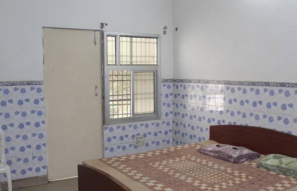 Postel nebo postele na pokoji v ubytování Hotel Satya Narayan