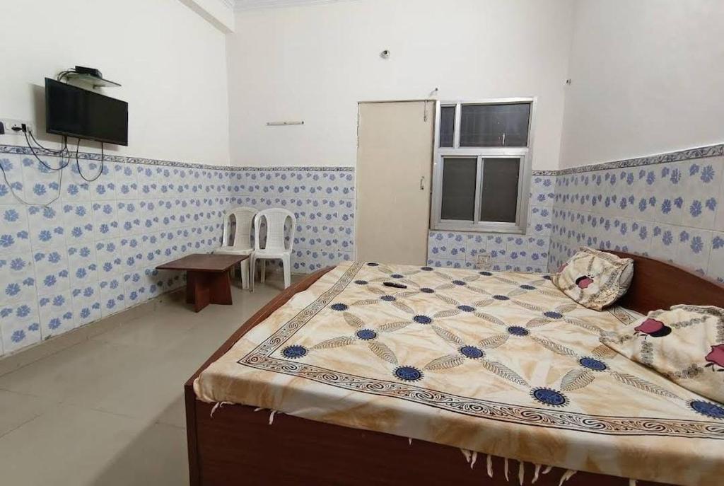 Postel nebo postele na pokoji v ubytování Hotel Satya Narayan