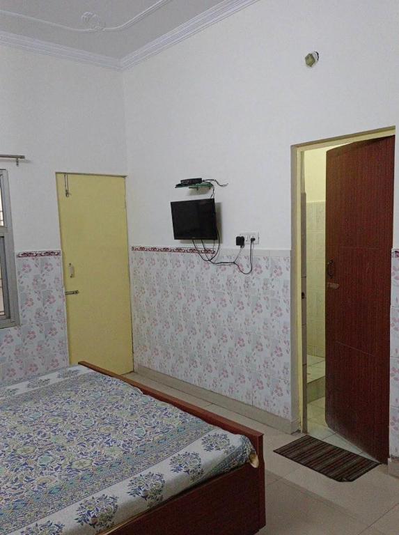 Postel nebo postele na pokoji v ubytování Hotel Satya Narayan