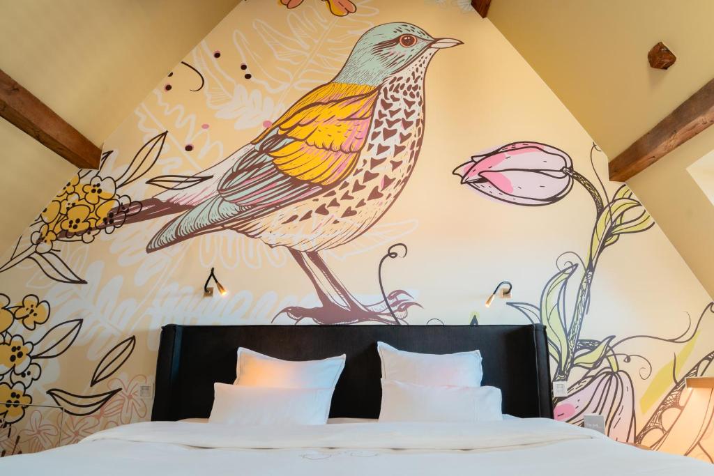 Postel nebo postele na pokoji v ubytování B&B La Suite