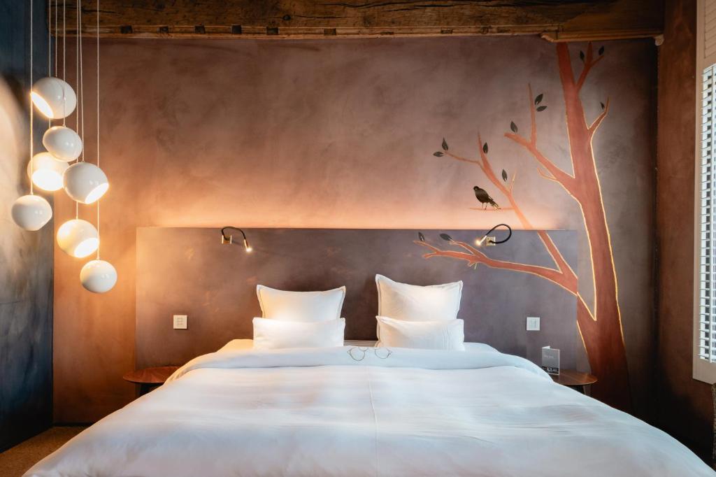 Postel nebo postele na pokoji v ubytování B&B La Suite