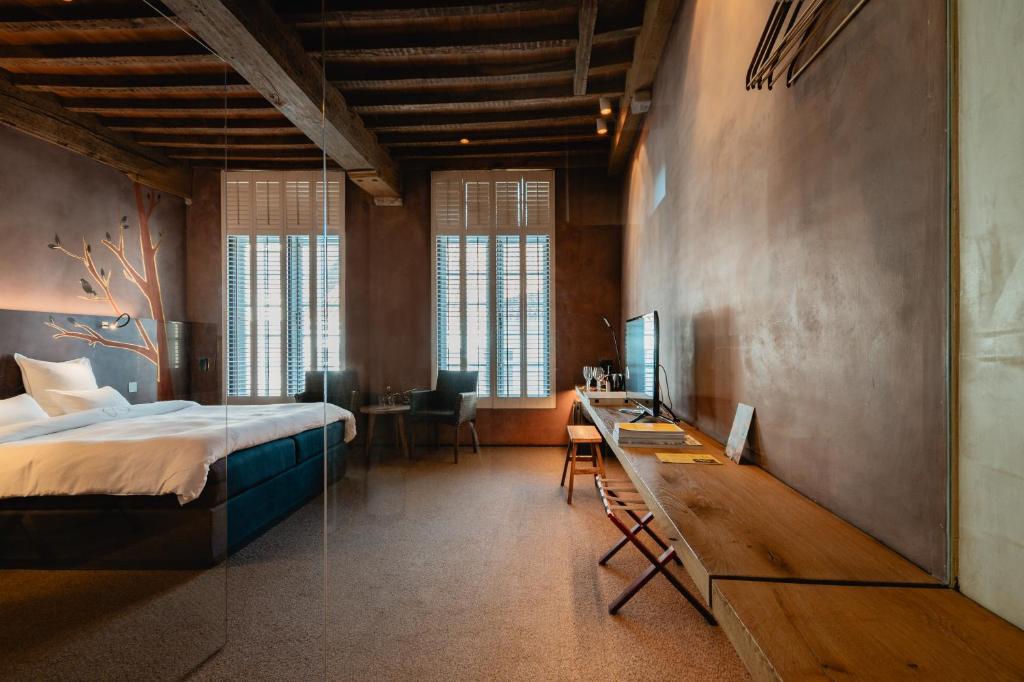 Postel nebo postele na pokoji v ubytování B&B La Suite