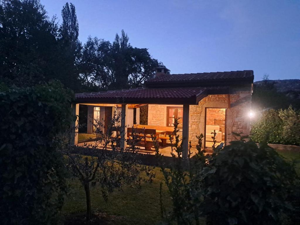 a small house with a table and chairs in front of it at Konoba DB in Čapljina