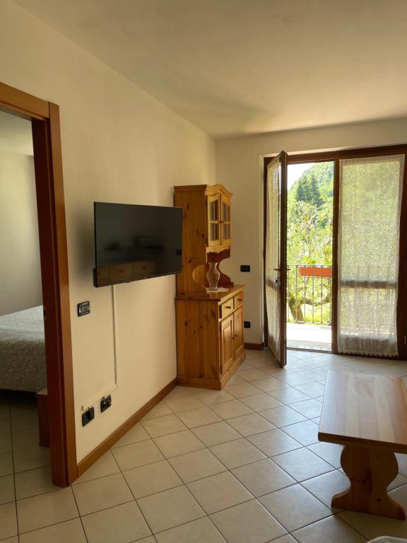 TV a/nebo společenská místnost v ubytování Casa Teodoro - Gelsomino, Ulivi & Orchidea