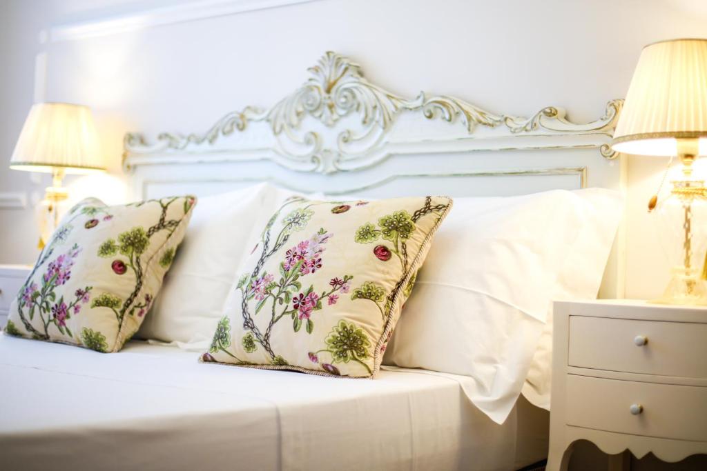 Postel nebo postele na pokoji v ubytování B&B Le Bianche