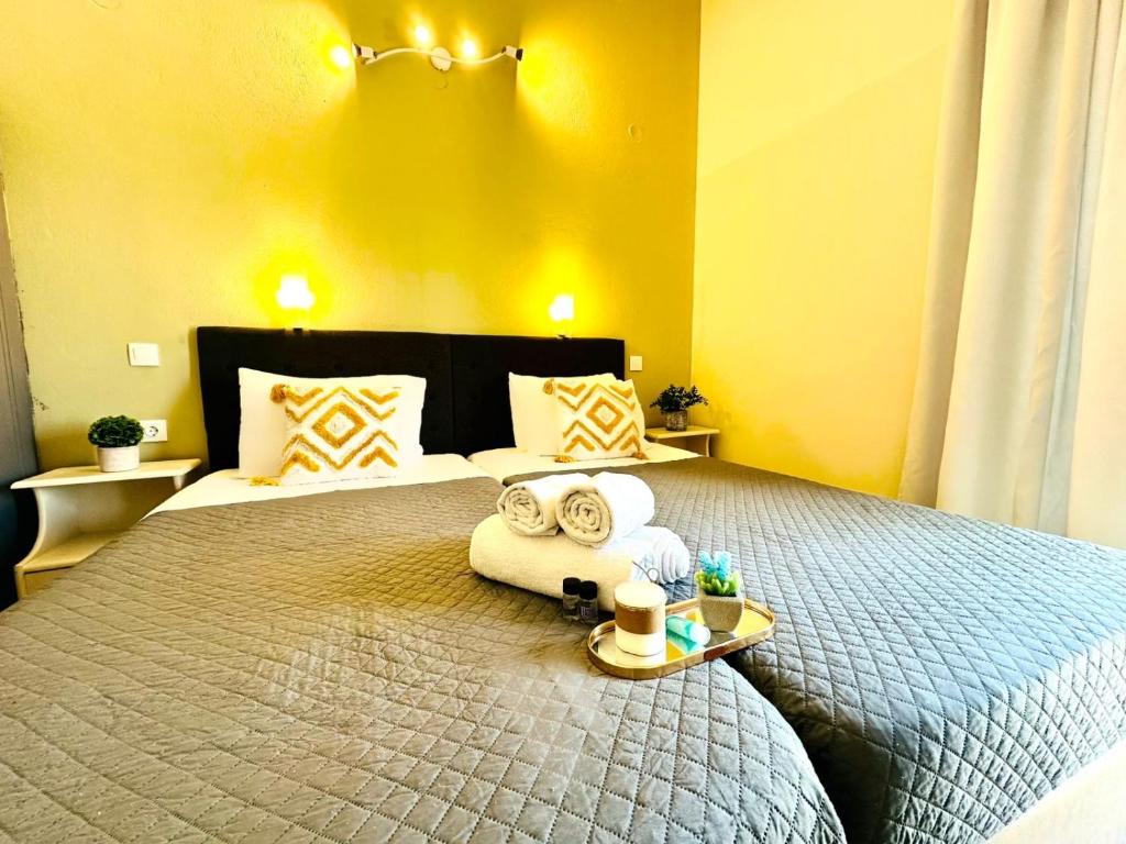 Postel nebo postele na pokoji v ubytování Sidari Vibes Aparthotel