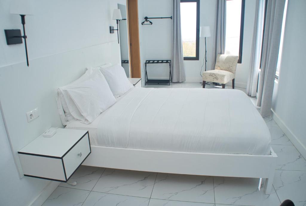 Postel nebo postele na pokoji v ubytování The View Hotel CV