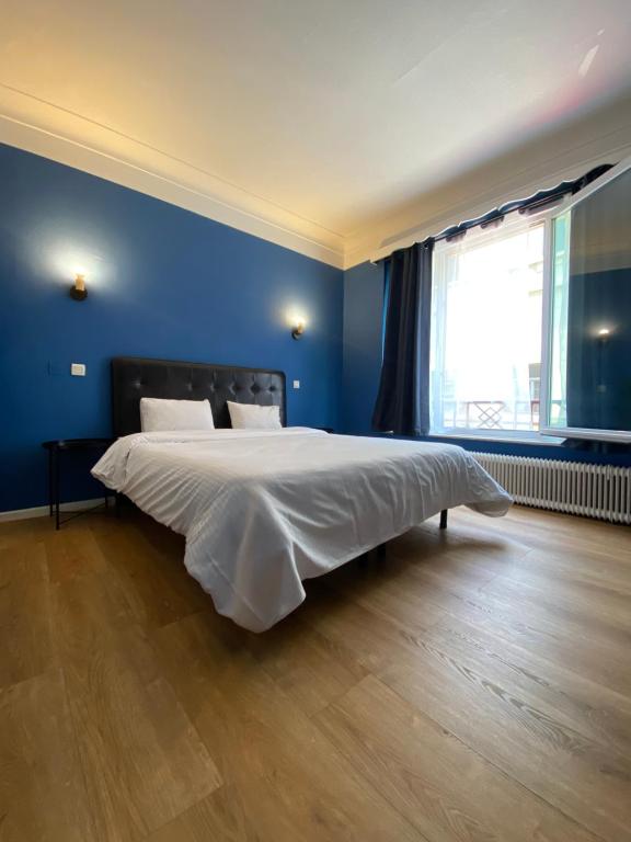 Postel nebo postele na pokoji v ubytování Hotel Windsor