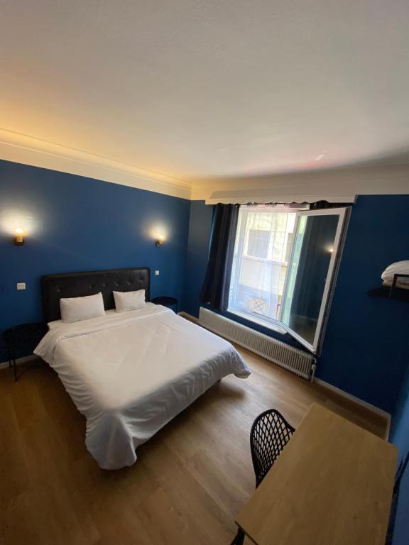Postel nebo postele na pokoji v ubytování Hotel Windsor