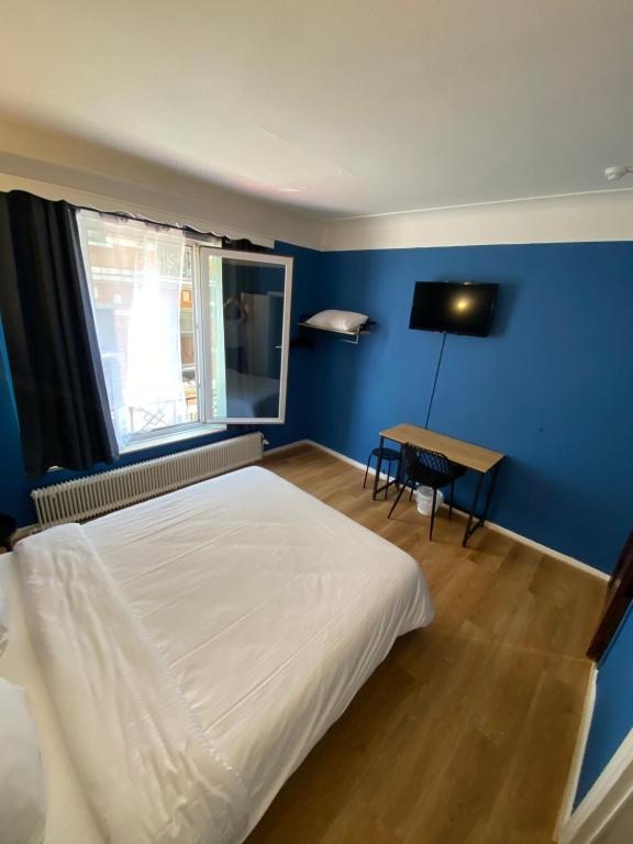 Postel nebo postele na pokoji v ubytování Hotel Windsor