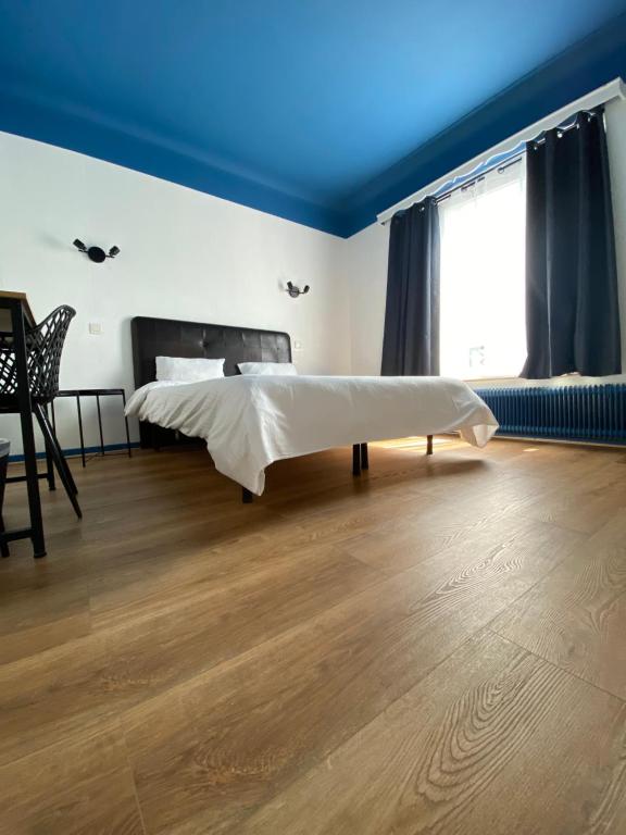 Postel nebo postele na pokoji v ubytování Hotel Windsor