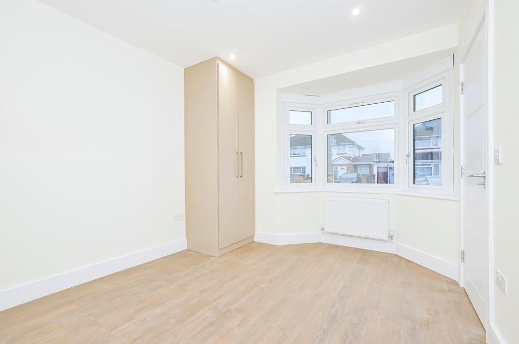 an empty room with white walls and a window at Luxury, comfort and Elegant Home in Hillingdon
