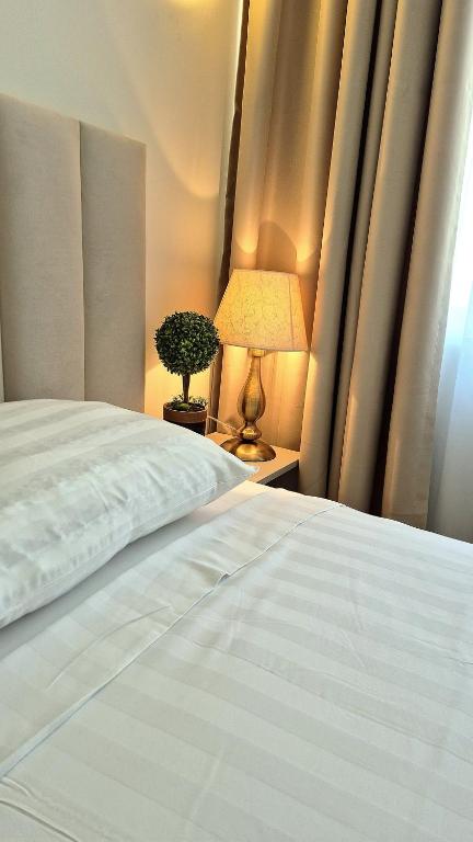 Postel nebo postele na pokoji v ubytování Hotel Marie