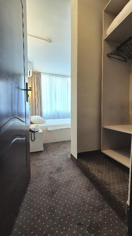 Postel nebo postele na pokoji v ubytování Hotel Marie