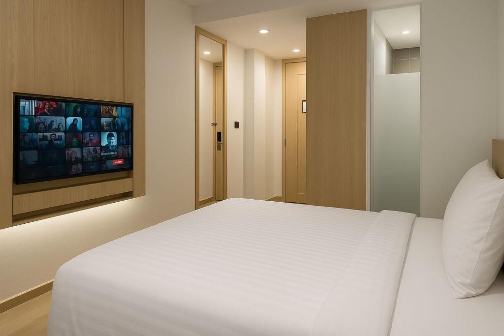 TV a/nebo společenská místnost v ubytování QNZ Hotel Jakarta