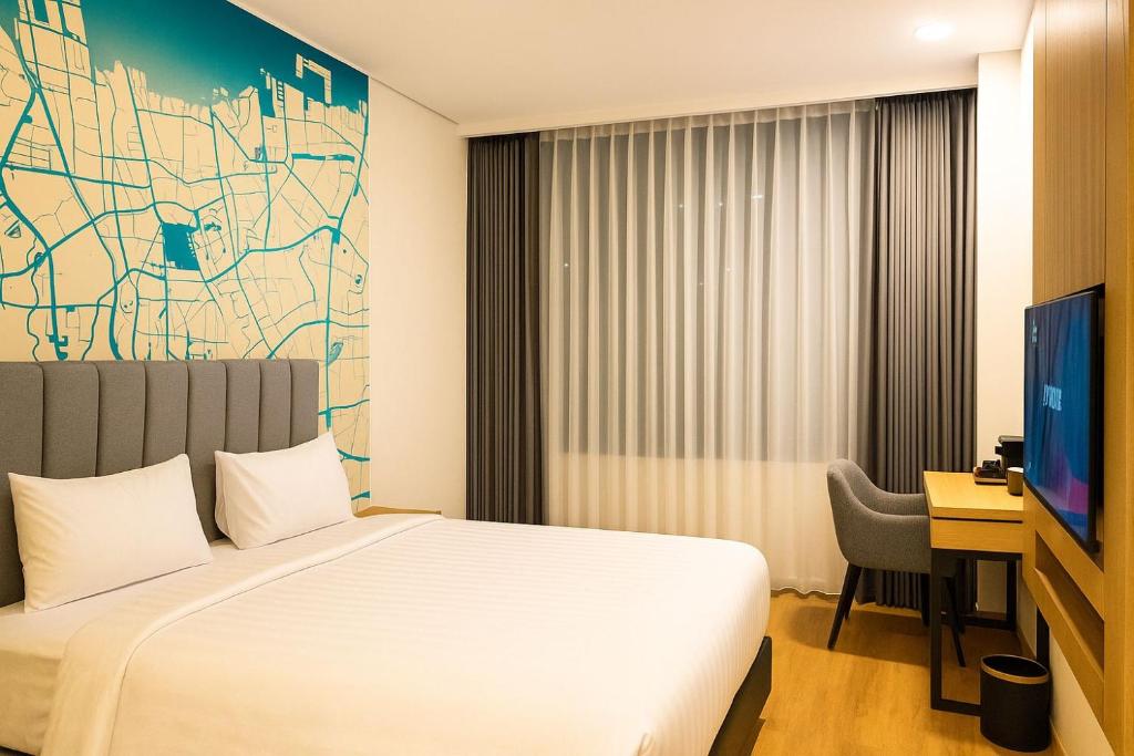 TV a/nebo společenská místnost v ubytování QNZ Hotel Jakarta