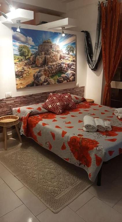 Postel nebo postele na pokoji v ubytování B&B Su Nuraghe
