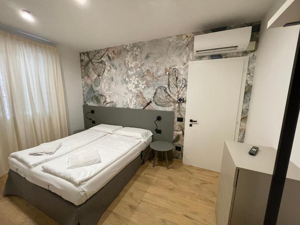 Postel nebo postele na pokoji v ubytování Residence Mirabel