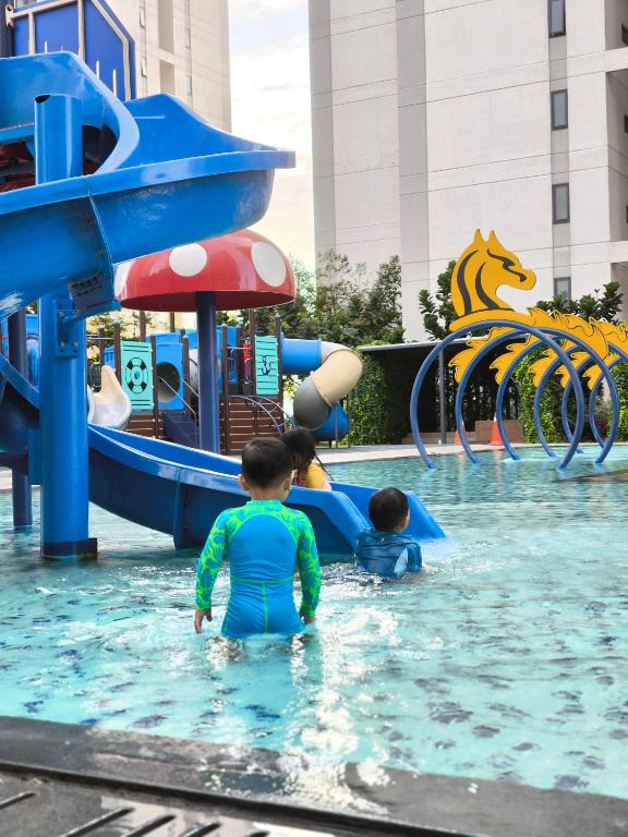 a group of children playing in a water park at Horizon Staycation w WiFi in Sepang