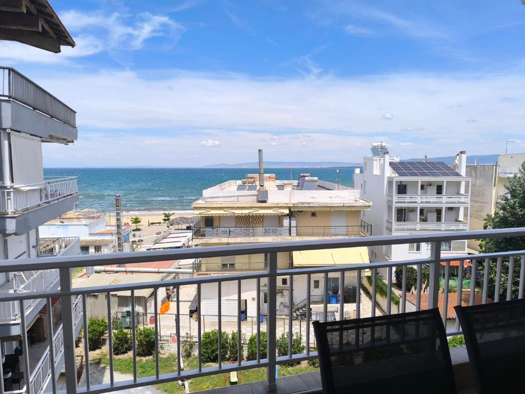 a view of the ocean from a balcony at Aphrodite Sea View Apartment in Perea