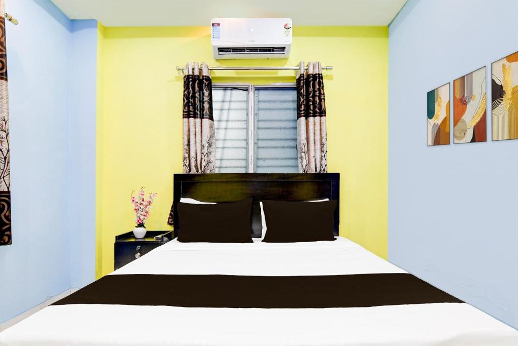 Postel nebo postele na pokoji v ubytování Hotel O The Orchid Residency