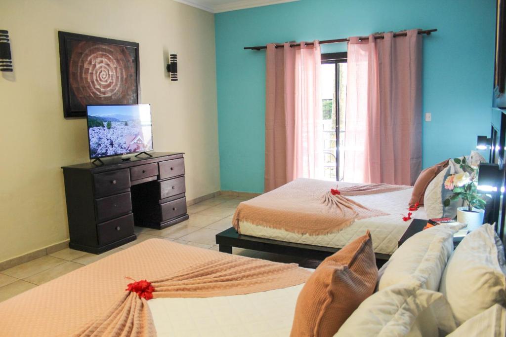 Postel nebo postele na pokoji v ubytování hotel plaza BRISAS MT