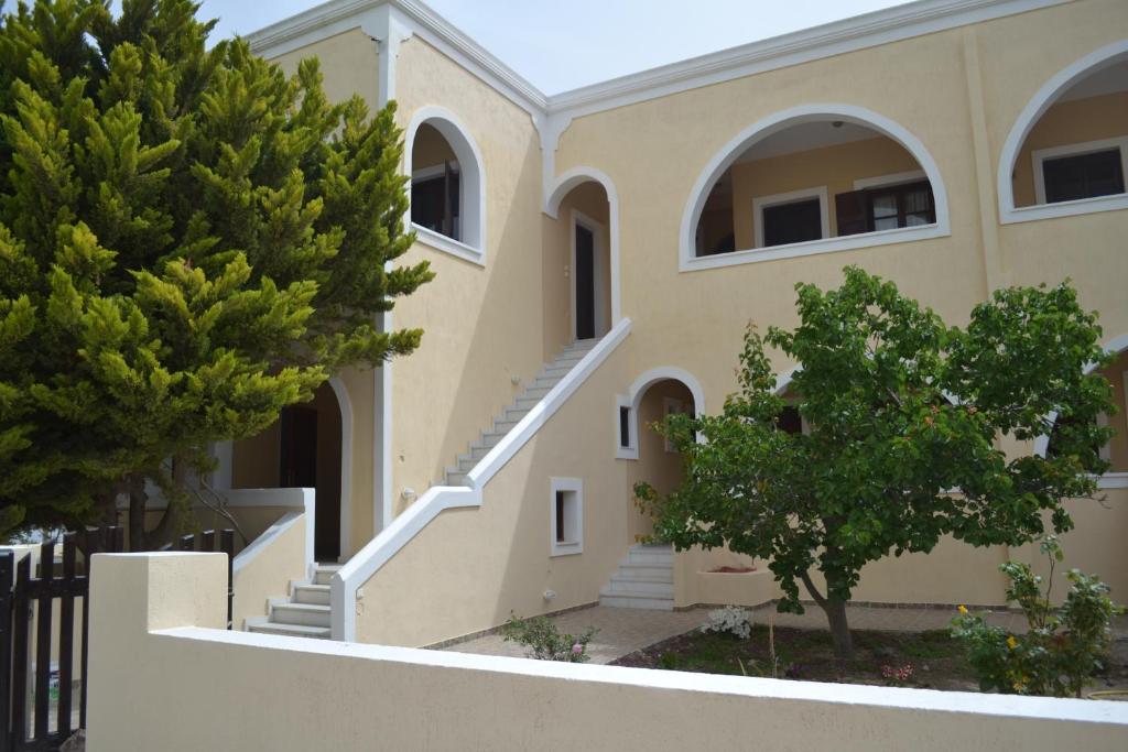 a house with trees in front of it at Floralia in Karterados