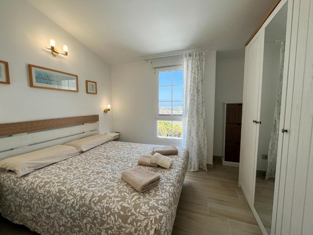 Postel nebo postele na pokoji v ubytování Bungalows Sonneland Maspalomas Canary Islands